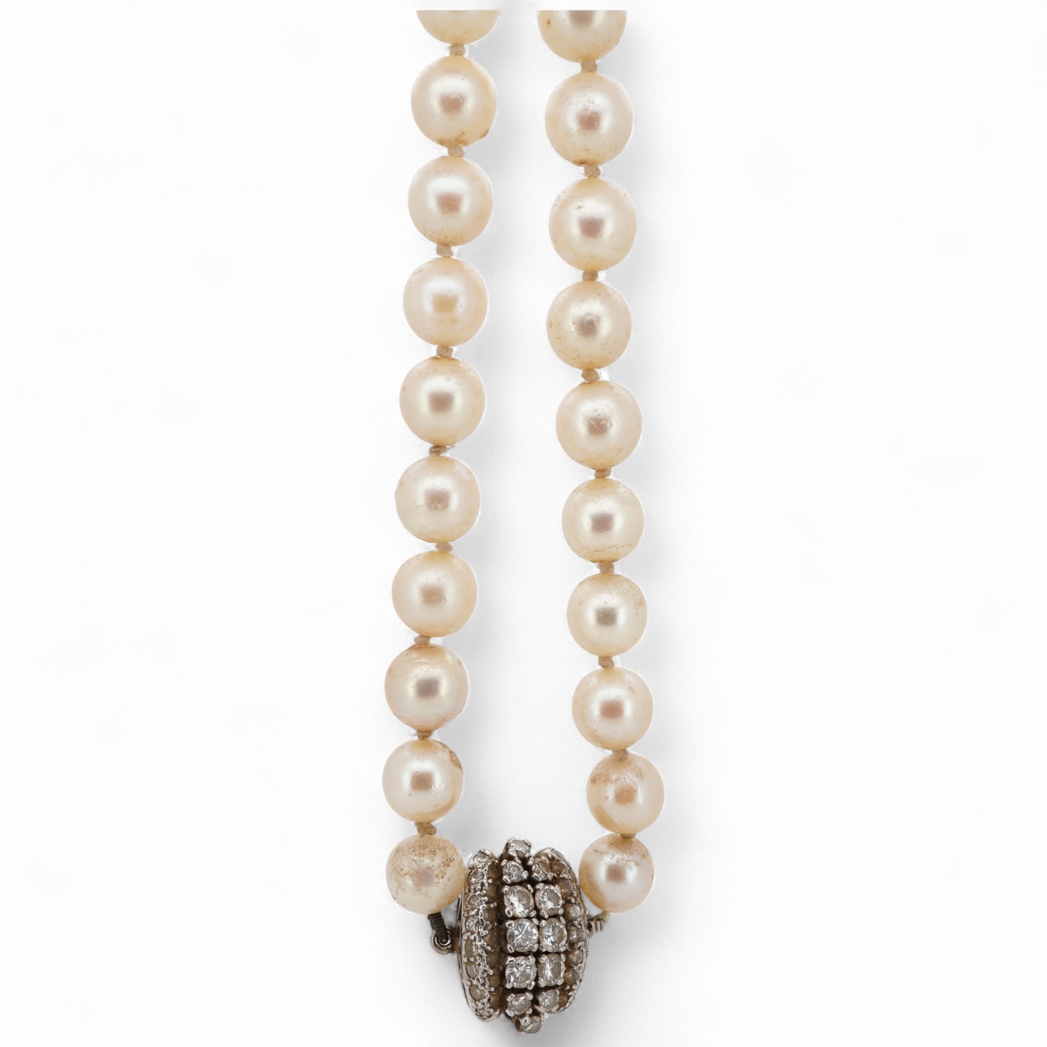 A single strand cultured pearl necklace, with white metal clasp set with two rows of graduated diamonds with a diamond chip border, 72cm.